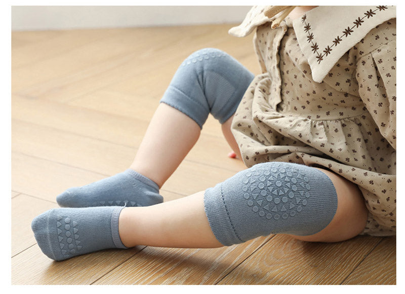 Newborn crawling essentials: protective knee pads and slip-resistant socks in a bundle.