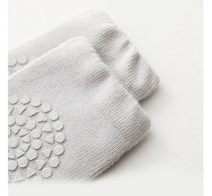 Baby knee pads & anti-slip socks, providing comfort and preventing slips during playtime.