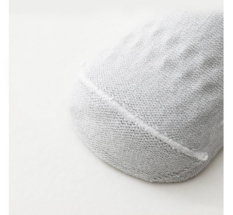 Infant safety gear: durable crawling knee pads and non-slip socks, machine washable.