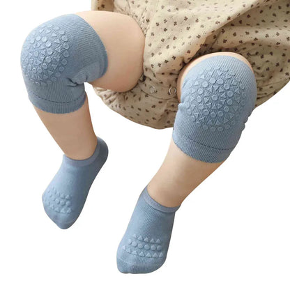 Toddler safety set: cushioned knee pads for crawling & grip socks for slippery surfaces.