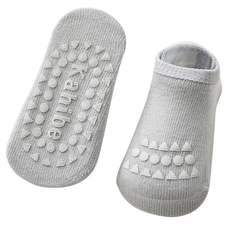 Baby gear: protective knee pads and anti-slip socks for active crawlers and new walkers.