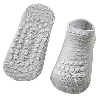 Baby gear: protective knee pads and anti-slip socks for active crawlers and new walkers.