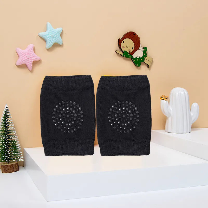 Soft cotton baby knee pads, essential baby accessory for new crawlers, white.