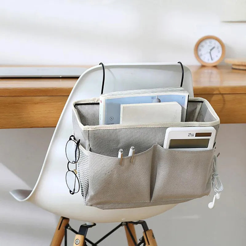 Space-saving baby storage bag for crib side, perfect for keeping nursery essentials organized.