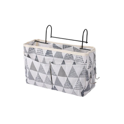 Functional hanging storage for baby crib, keeps diapers, wipes, and small toys organized.