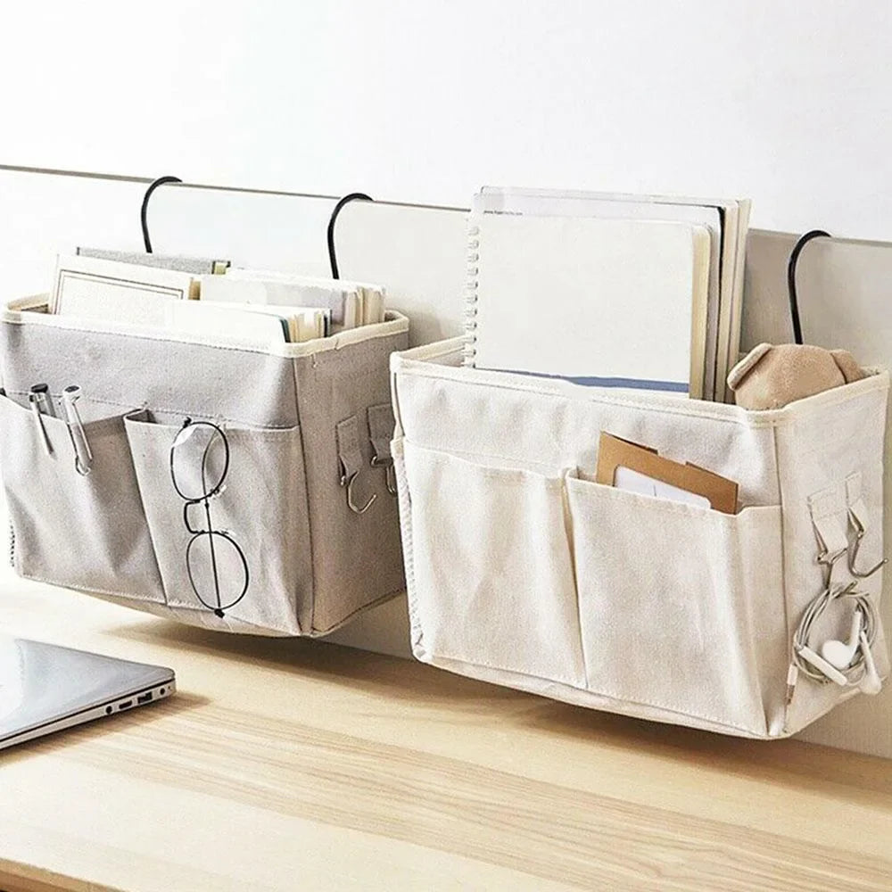 Compact diaper caddy and bedside storage bag hangs on a crib, ideal for baby essentials.