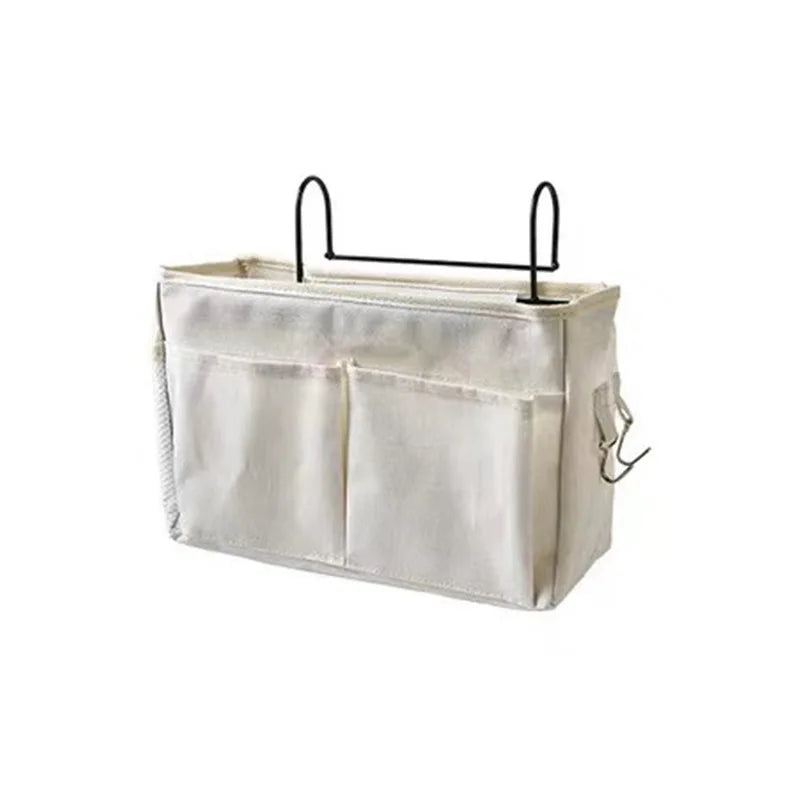Hanging baby crib organizer, multi-pocket design in nursery decor for diapers and wipes.