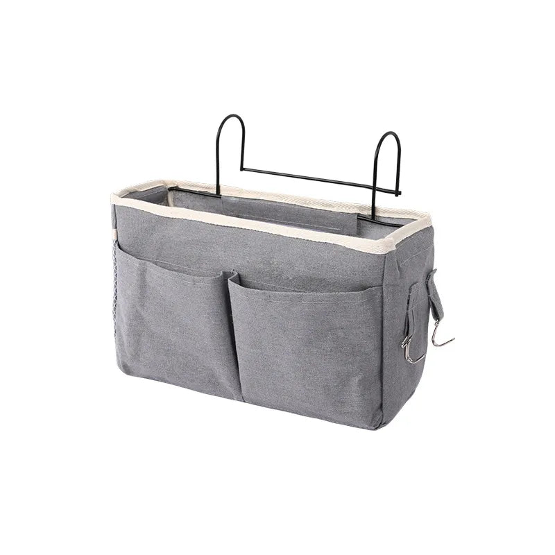 Baby storage caddy for crib, convenient bedside organizer for newborn care essentials.
