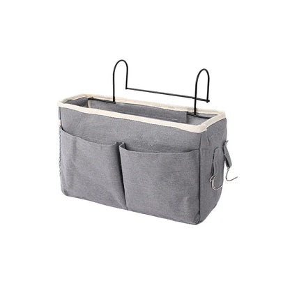 Baby storage caddy for crib, convenient bedside organizer for newborn care essentials.