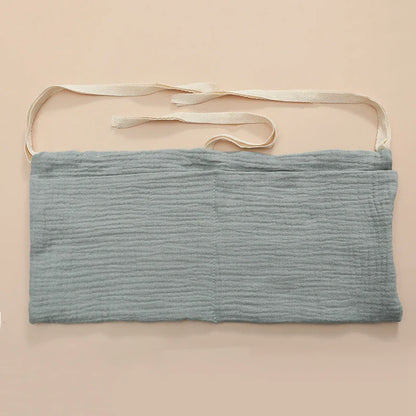Diaper caddy solution: cotton crib organizer, perfect for quick diaper changes in the nursery.
