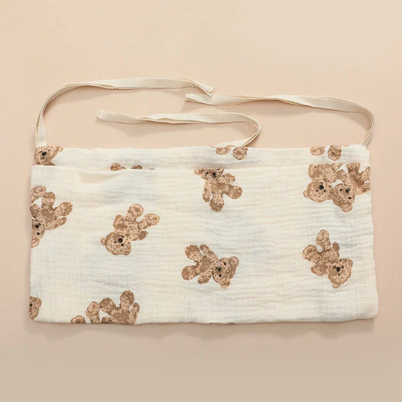 Stylish patterned cotton crib storage bag, enhancing nursery decor while providing utility.