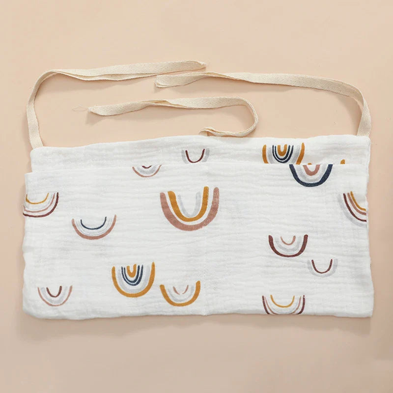 Securely fastened cotton crib storage bag, demonstrating a stable and safe design for nurseries.