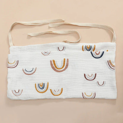 Securely fastened cotton crib storage bag, demonstrating a stable and safe design for nurseries.