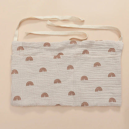 Soft, durable cotton crib organizer, designed to keep baby's essentials tidy and accessible.