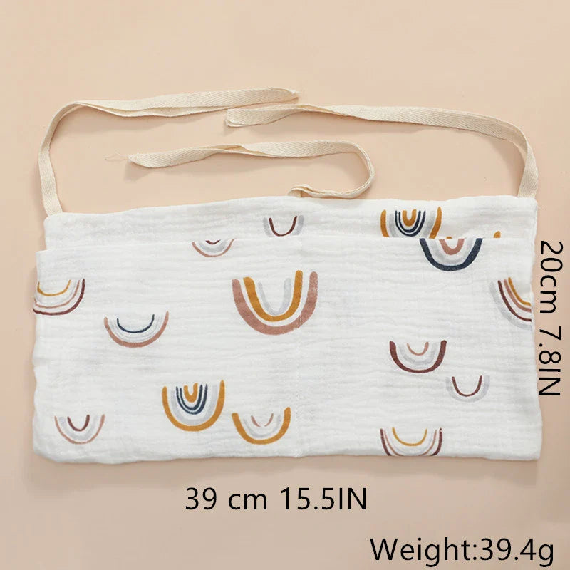 Nursery decor: cotton crib hanging organizer, ideal for baby bottles and wipes.