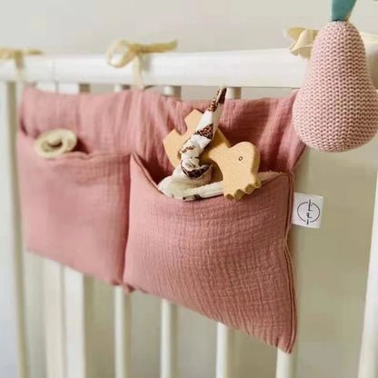 Close-up of a textured cotton crib storage bag with reinforced stitching, baby shower gift idea.