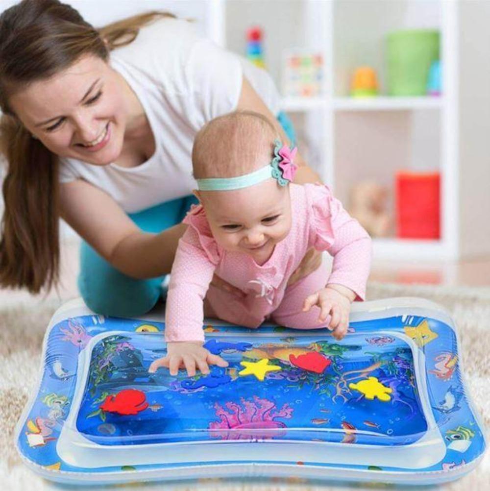 Close-up of leak-proof baby tummy time water mat with colorful floating toys inside for sensory play.