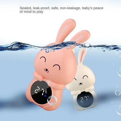 Digital bath thermometer with LED display, a floating toy for child safety during bath time.