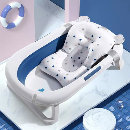 Baby foldable bath support mat for infant comfort, white with star pattern, in a tub