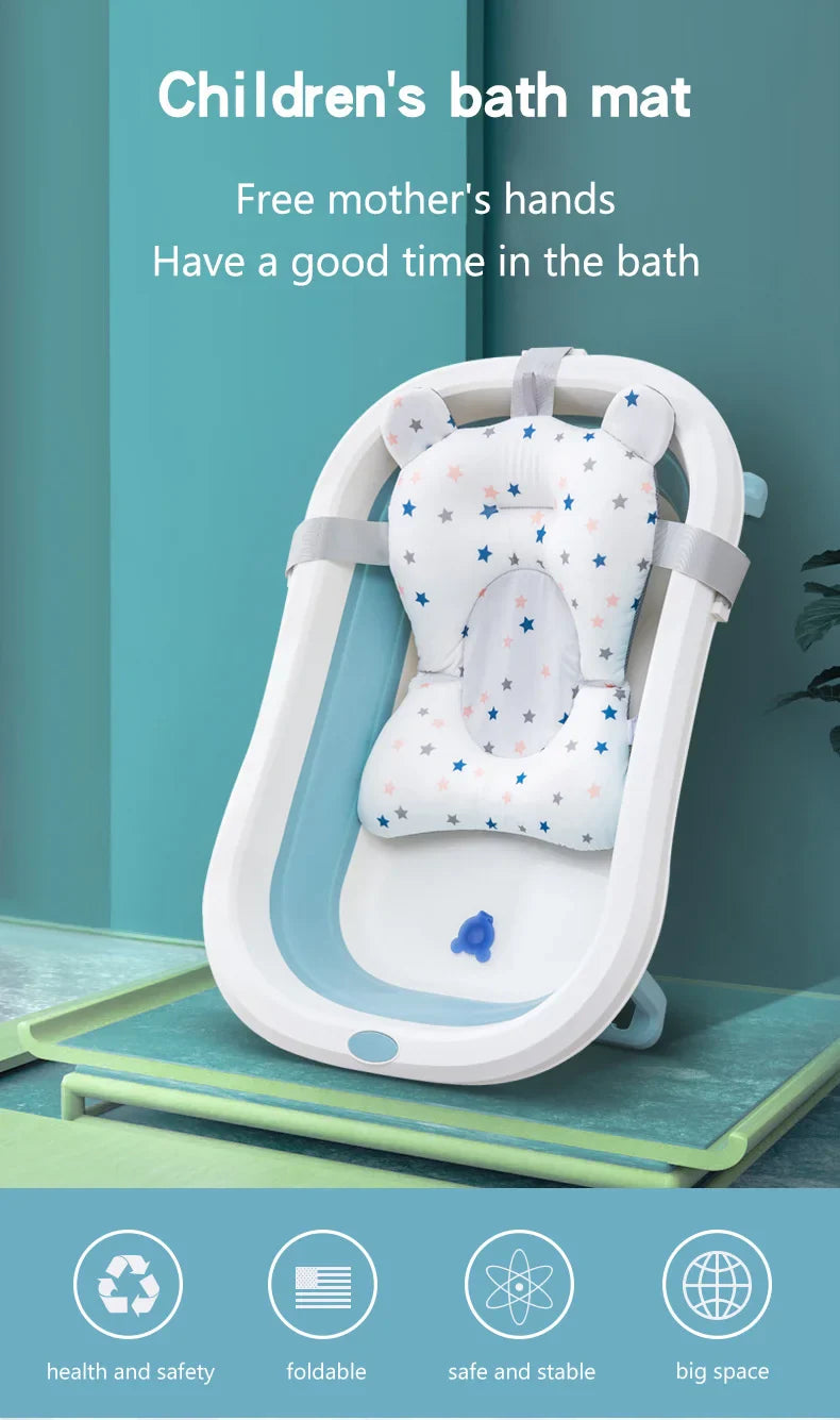 Child enjoying bath on a yellow foldable support mat with colorful star accents