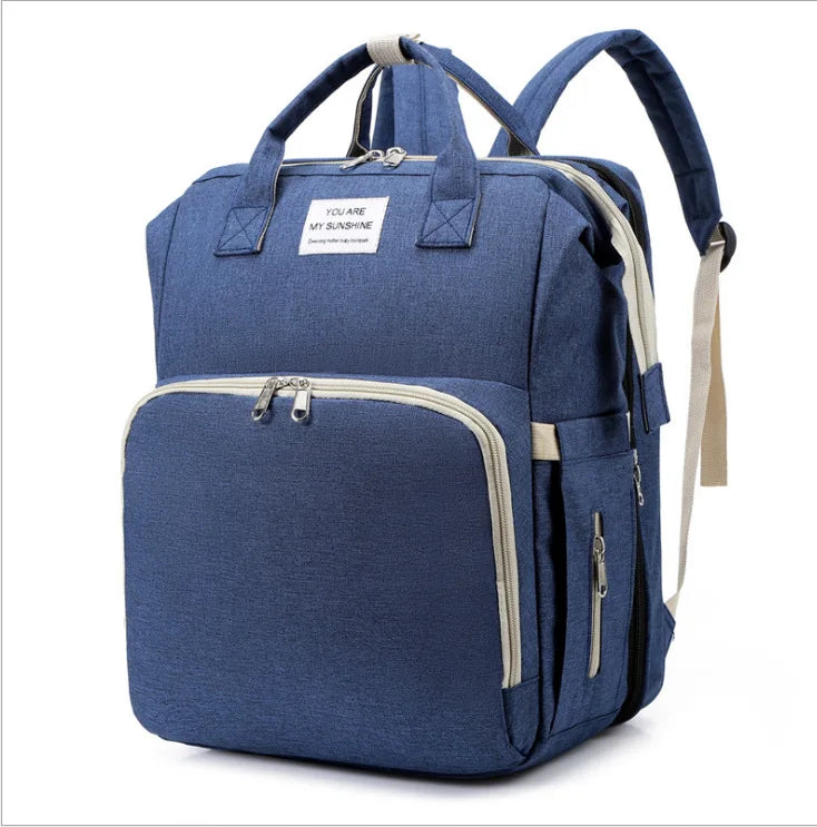 Modern baby backpack: foldable crib, USB interface, portable changing pad, and ergonomic design.