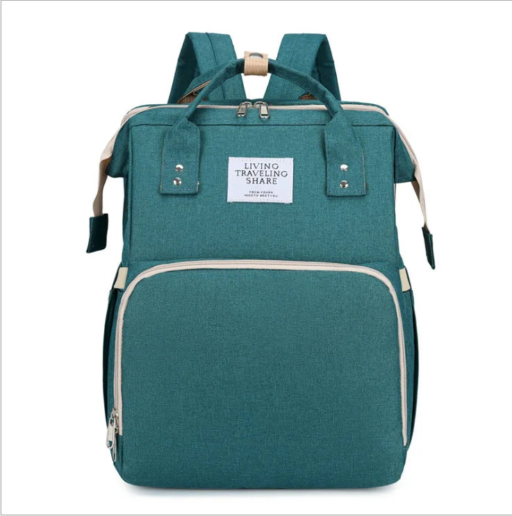 Travel-friendly baby foldable crib backpack with USB charging access and a changing mat.