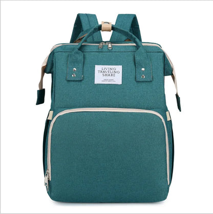 Travel-friendly baby foldable crib backpack with USB charging access and a changing mat.