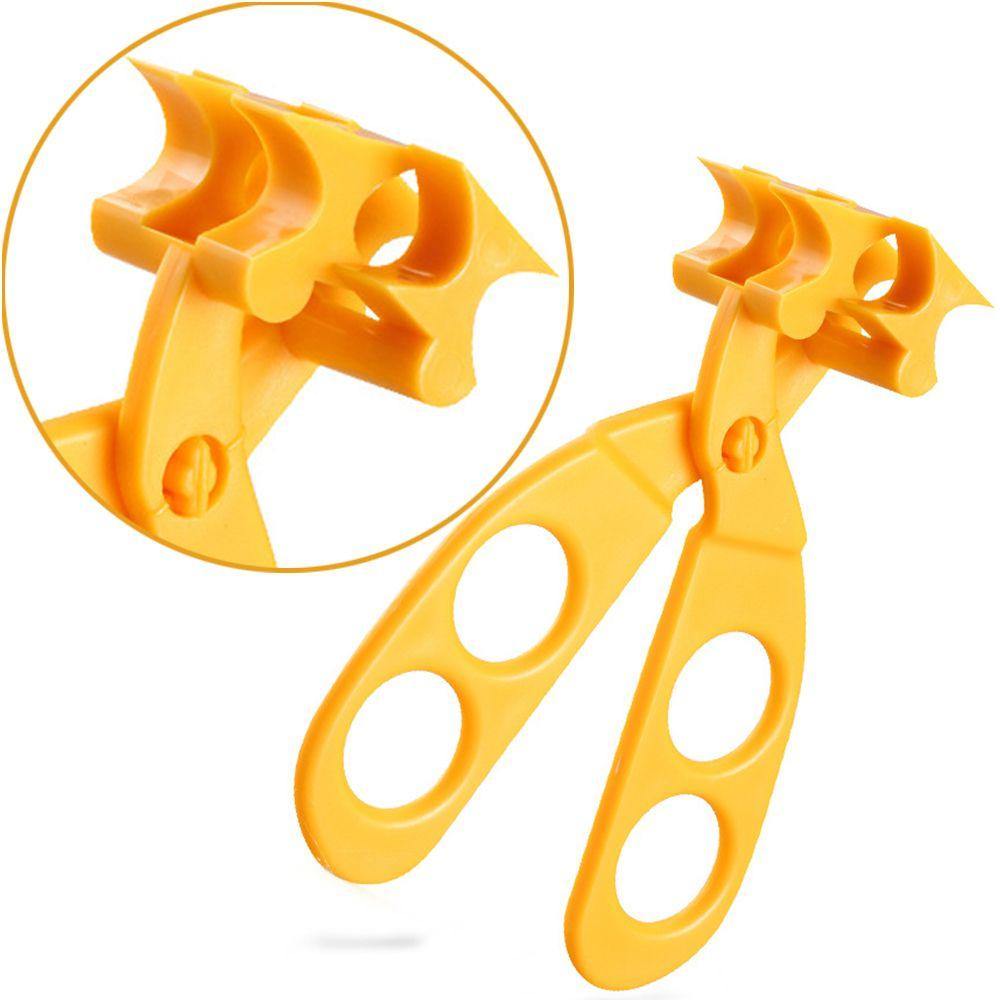Parent using baby food scissors to cut solid food into small pieces for infant