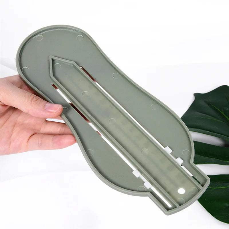 Newborn essentials: Baby foot gauge tool on a soft blanket, ready for use
