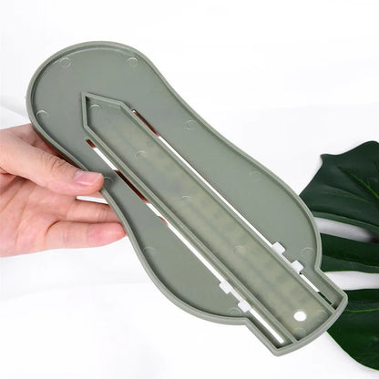 Newborn essentials: Baby foot gauge tool on a soft blanket, ready for use