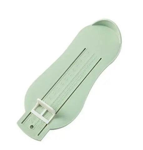 Parents using a baby foot measure tool to check their child's foot development