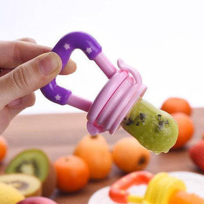 Baby fruit food feeder pacifier with yellow silicone nib, ideal for introducing solids. BPA-free.