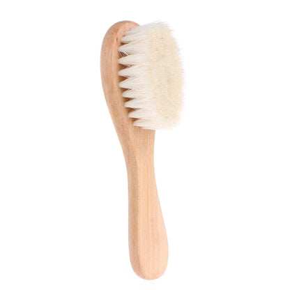 Close-up of Baby Gentle Scalp Brush, showing flexible silicone bristles for infant scalp massage.