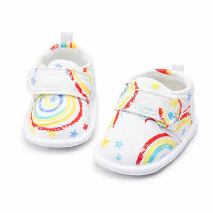 Child wearing animal print first walking shoes, non-slip sole, for active toddlers