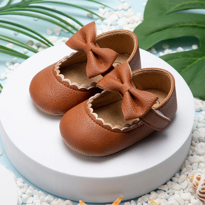 Pink baby girl anti-slip soft sole bow shoes, ideal for new walkers and comfort