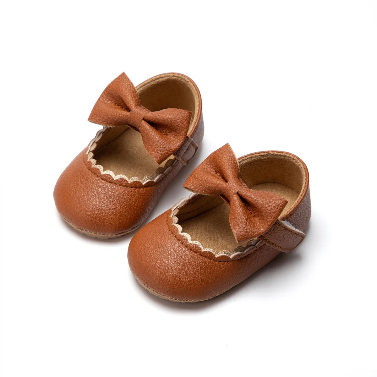 Soft sole baby girl walking shoes in pink with an anti-slip design and stylish bow
