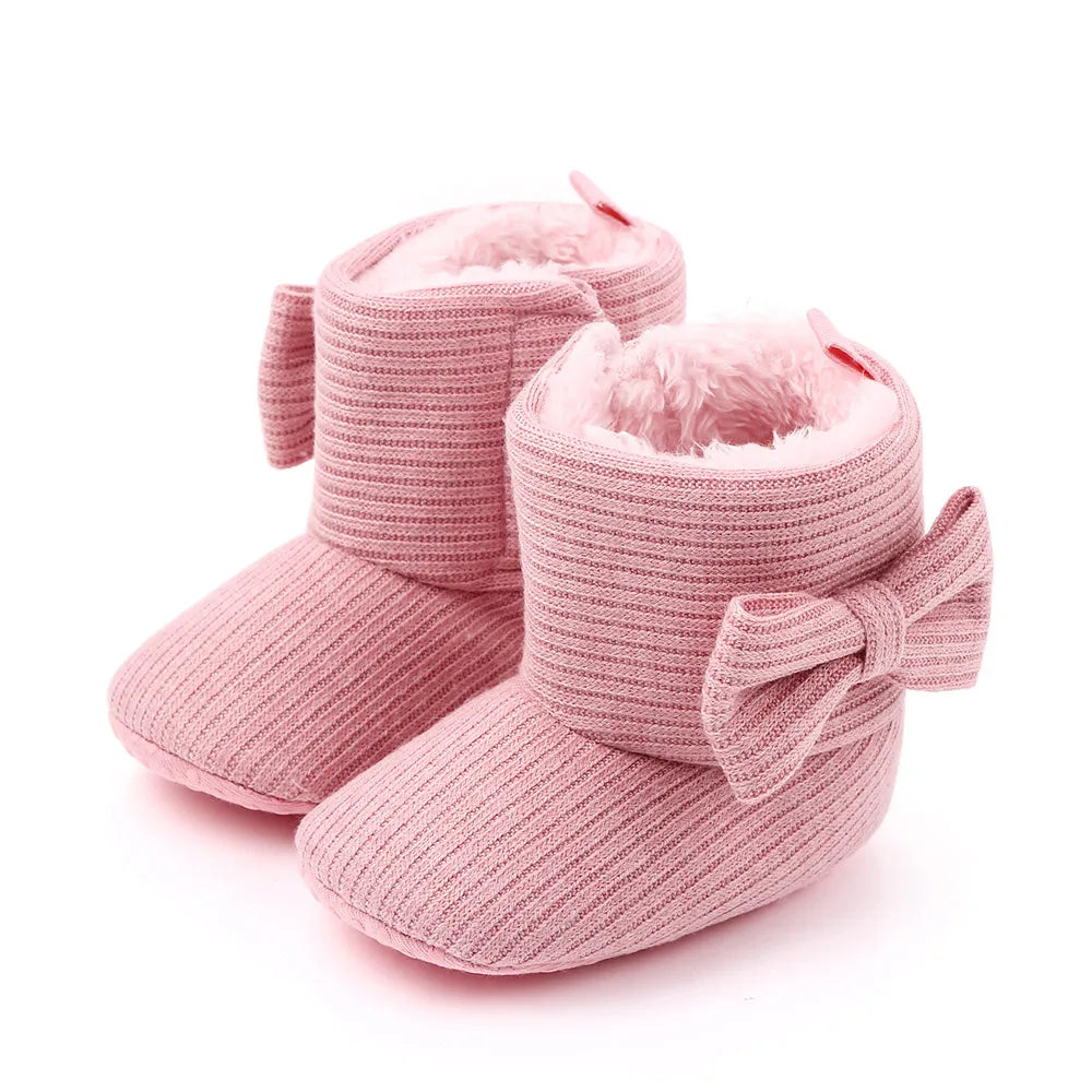 Rear view of baby girl's pink bowknot ankle boots, perfect for winter outings, soft sole