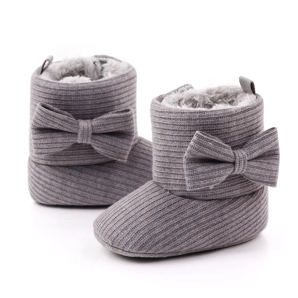 Warm and soft baby girl winter boots with a delicate bowknot on the ankle