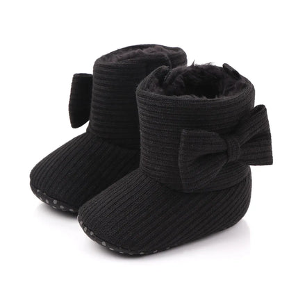 Baby girl's cozy knitted slip-on boots with a cute bowknot for winter comfort