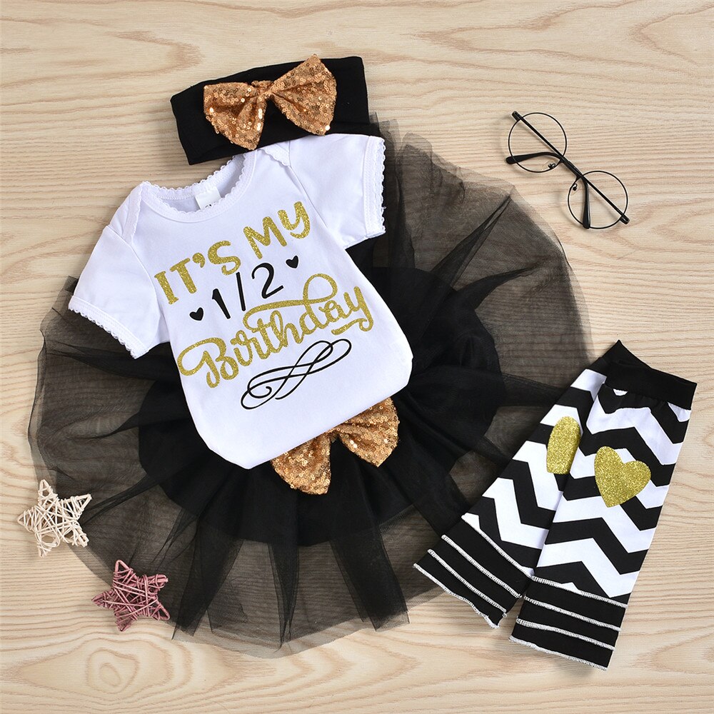 First birthday baby fashion: 'One' romper, fluffy pink tutu skirt & black and white leggings