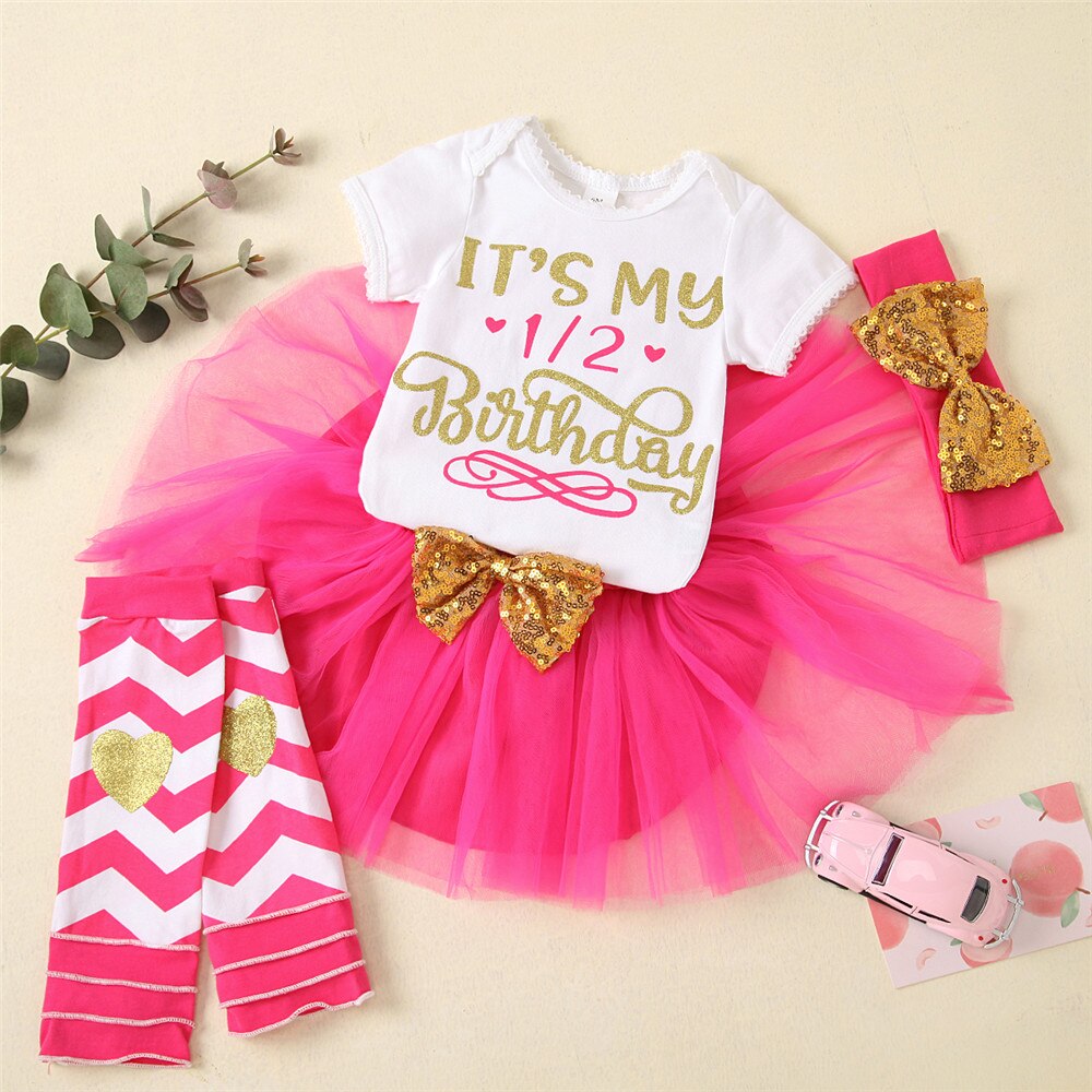 Infant girl's milestone clothing: a sweet romper, pink tutu, and striped leggings set