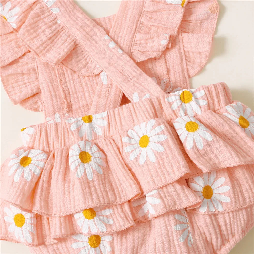 Sleeveless floral ruffle romper for baby girl with coordinating headband