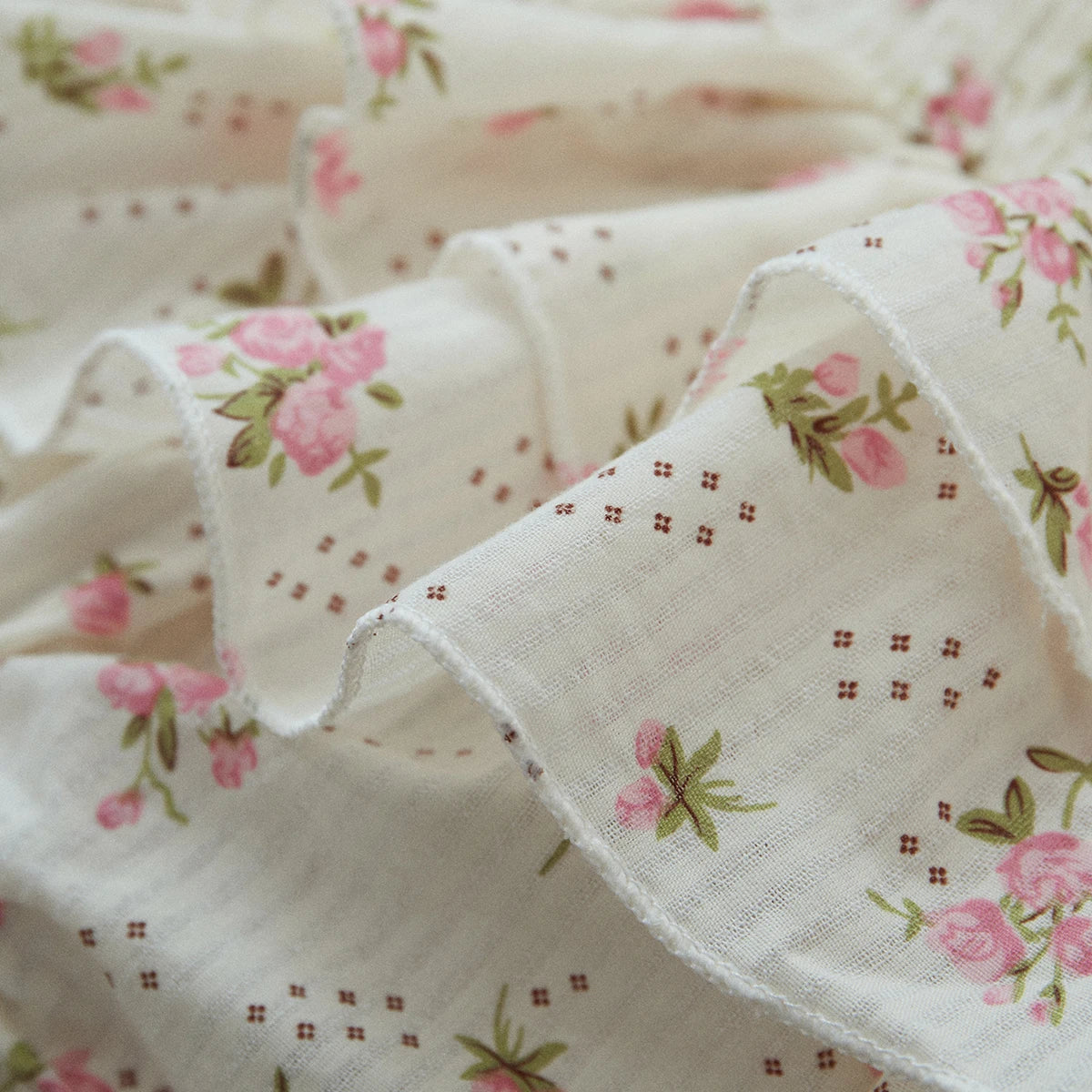 Infant girl's summer outfit: sleeveless floral print romper with ruffles and a matching stretch headband