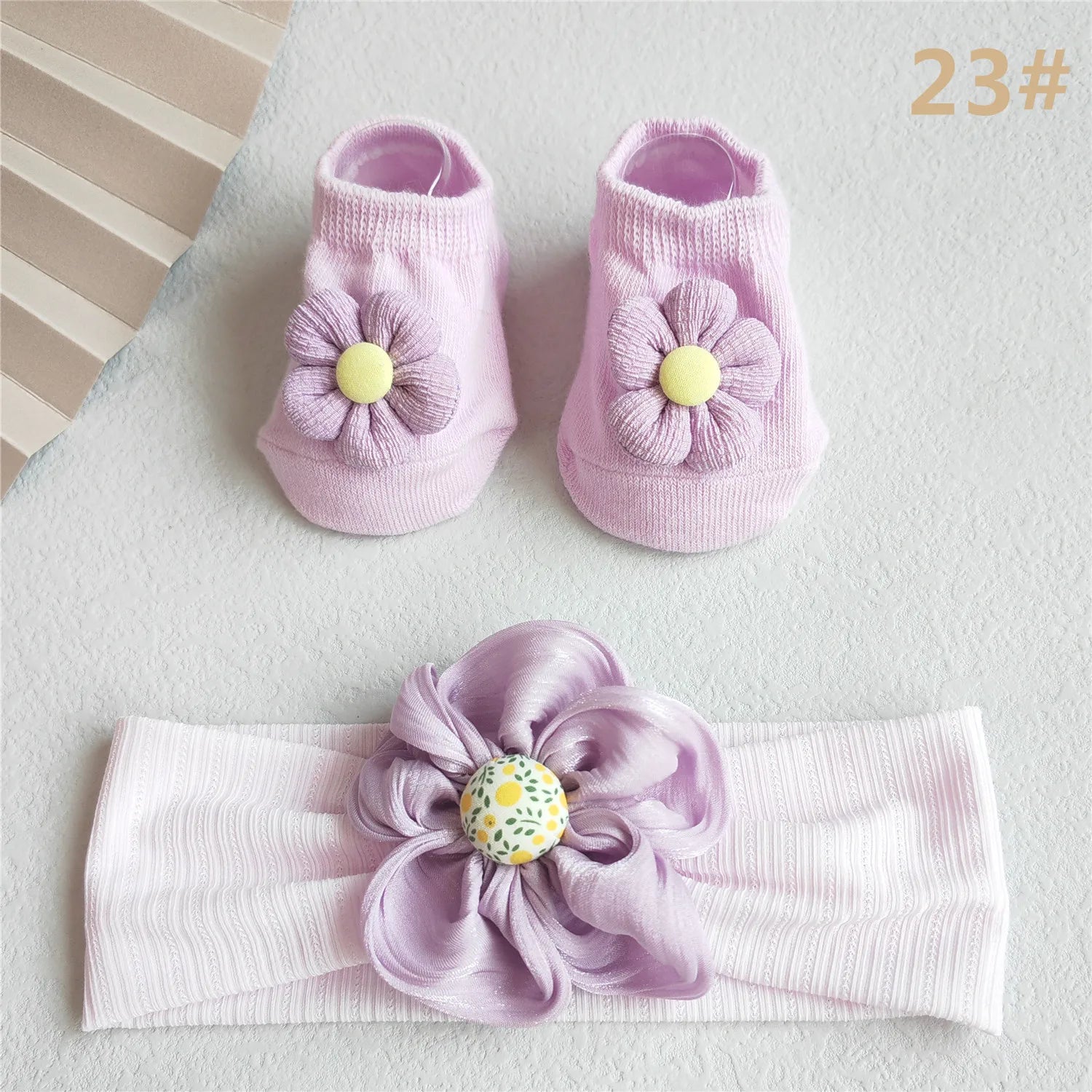 Close-up of the intricate lace pattern on the baby girl's pink headband bow for infants