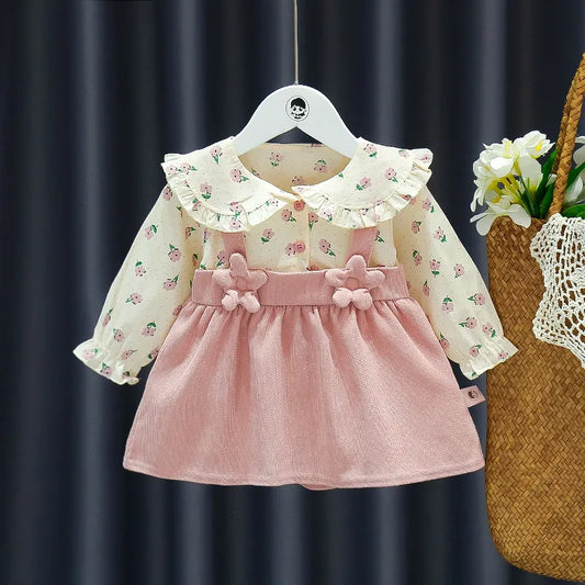 Knee-length girls' autumn dress featuring delicate flower appliques and a vibrant floral print.