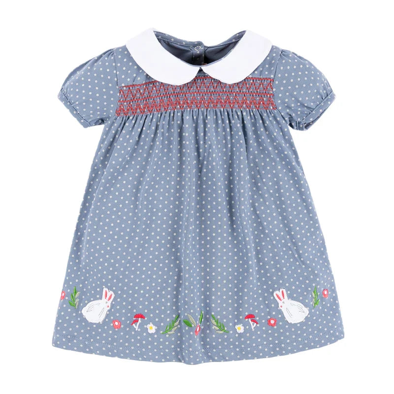 Baby girl in a pink cotton rabbit applique summer casual dress, perfect for playdates.