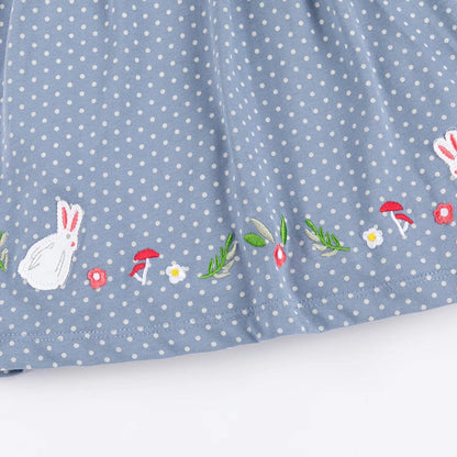 Embroidered rabbit detail on a sweet baby girls' cotton play dress, perfect for warm weather.