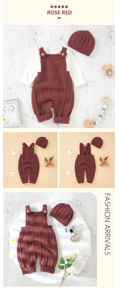 Happy baby girl in a sleeveless knitted romper and hat, enjoying a sunny day outdoors