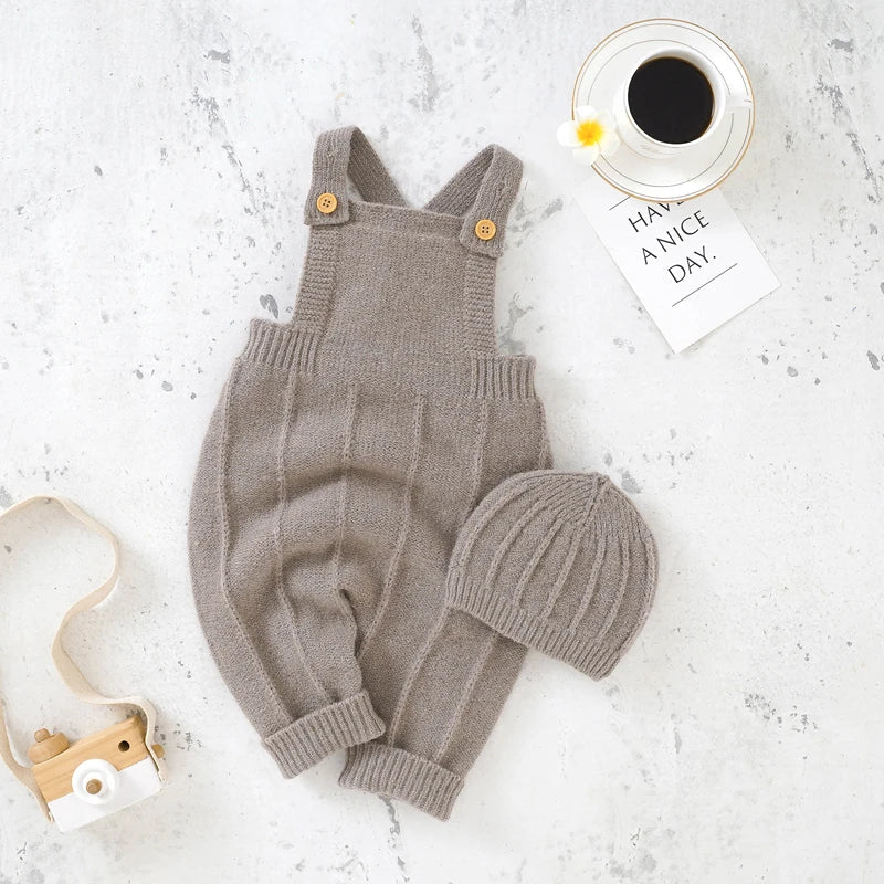 Close-up of square collar on a baby girl's knitted sleeveless romper and matching hat