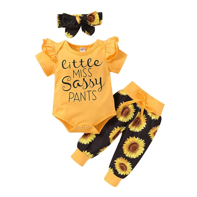 Adorable infant girl's cotton sunflower-print romper with snaps and a cute headwrap, ideal newborn gift.